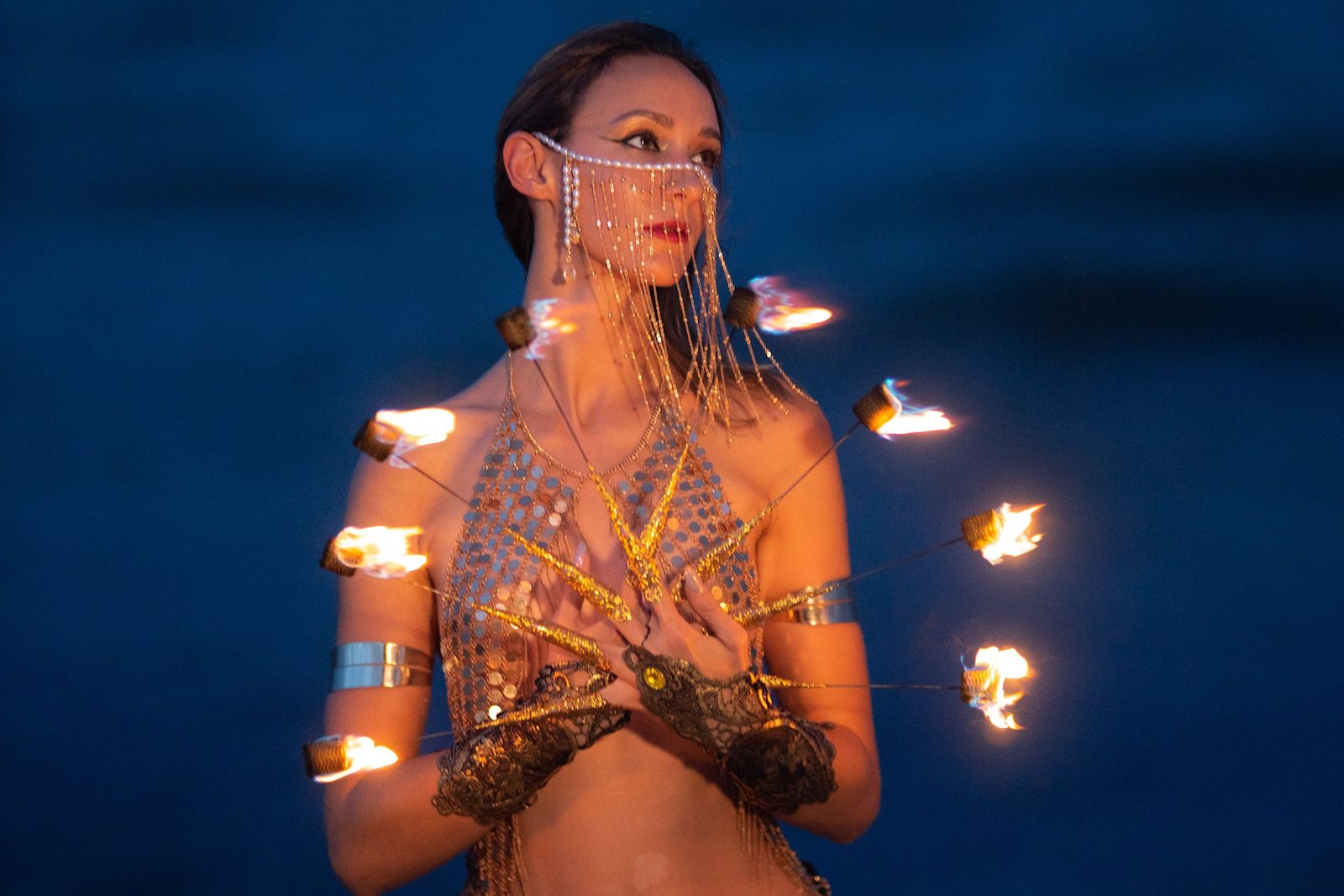 Fire fingers performance by Miami fire dancer