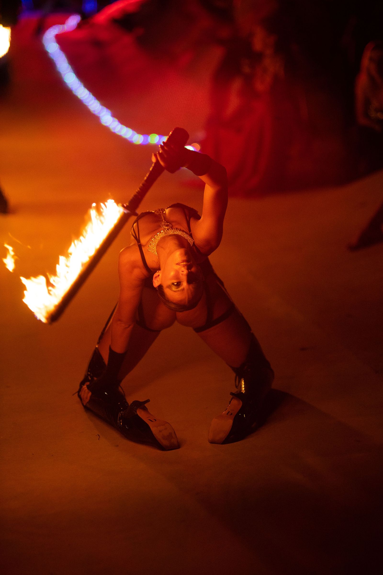 Fire dancer with fire swords at Miami event